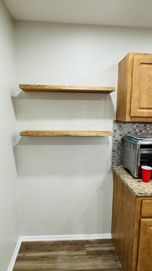 before, and after of floating shelves installation β after
